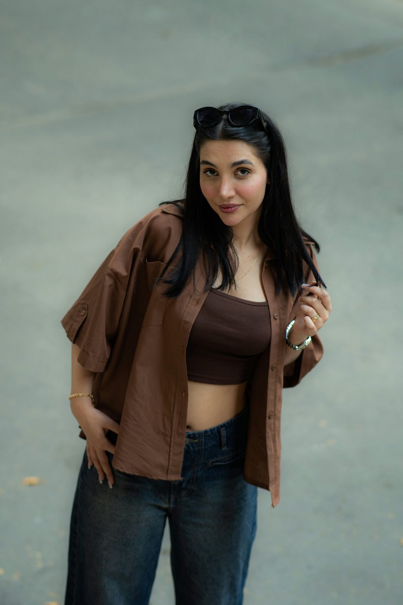 Young woman in stylish brown shirt and jeans photo – Free Green Image on Unsplash