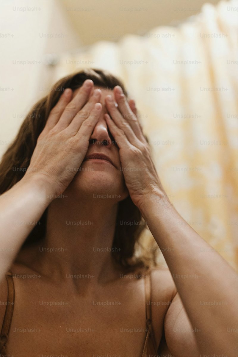 A woman covering her eyes with her hands photo – Sad Image on Unsplash A woman covering her eyes with her hands photo – Sad Image on Unsplash