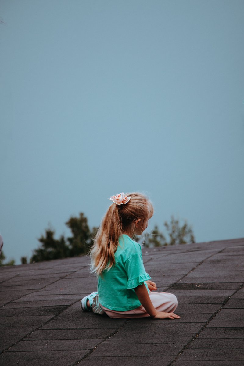 A Girl Sitting Outdoors · Free Stock Photo A Girl Sitting Outdoors · Free Stock Photo