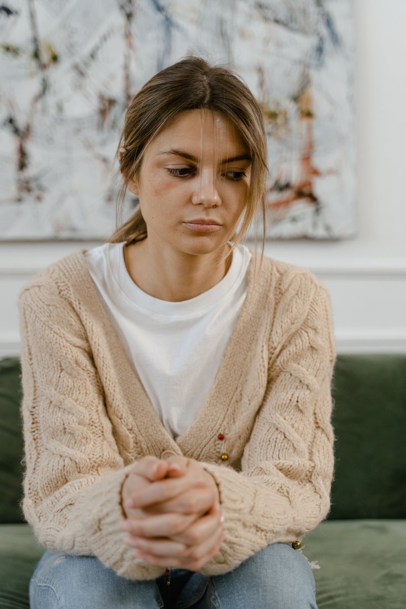 A Sad Woman Sitting on a Chair · Free Stock Photo