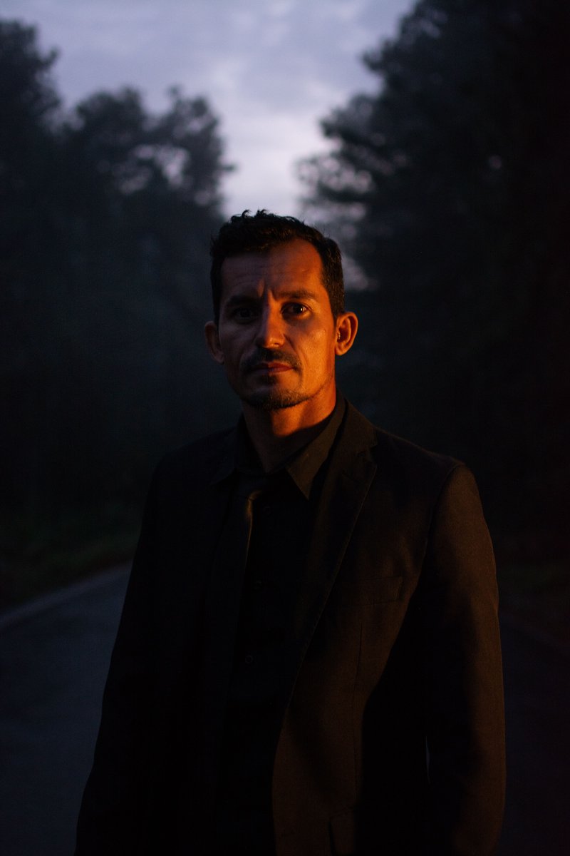 A Serious Man in Black Long Sleeves Looking at Camera while ...