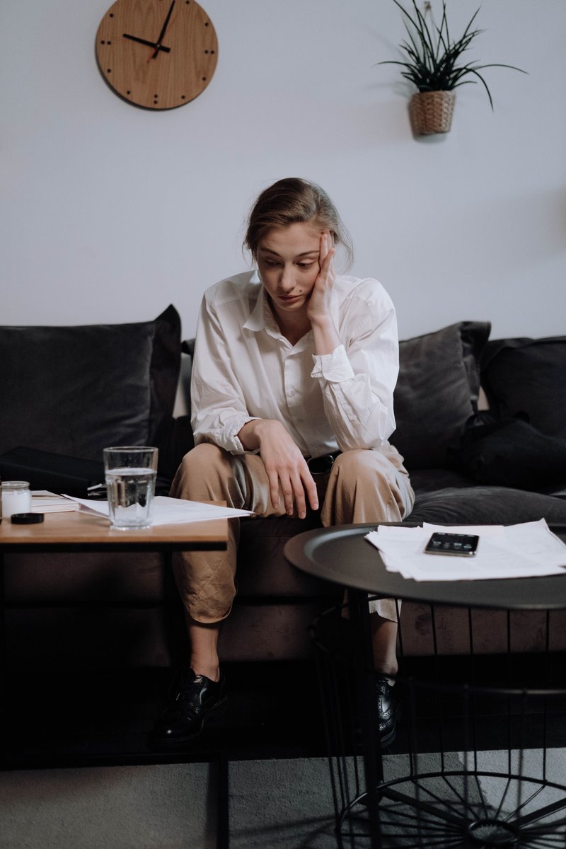 A Woman with Problems Sitting on the Sofa · Free Stock Photo