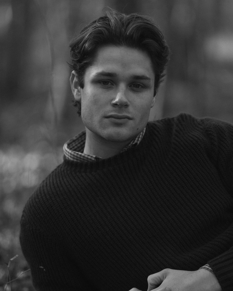 A black and white photo of a man in a sweater - Free Photo on Unsplash