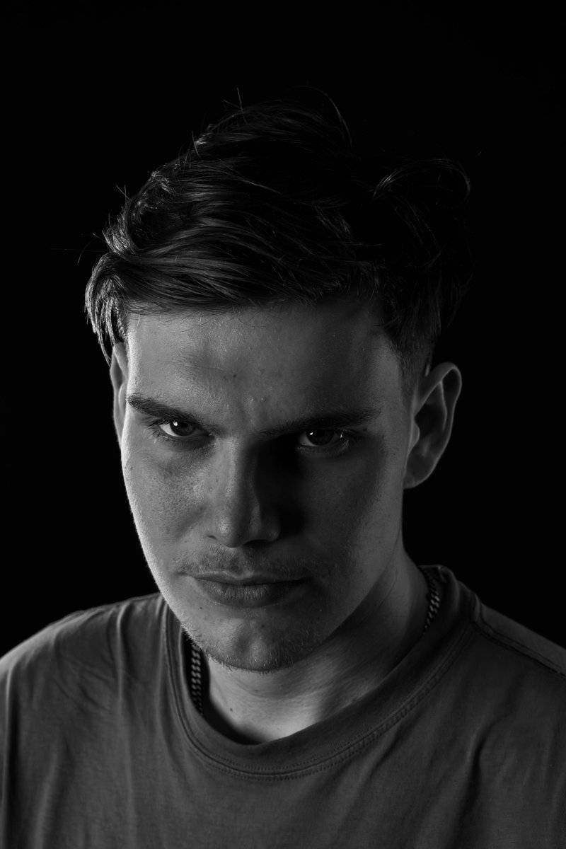 A man with a serious look on his face photo – Free Black background Image on Unsplash