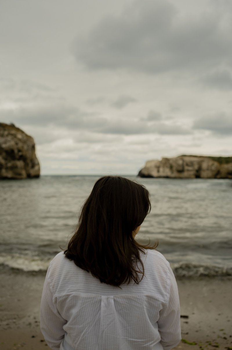 Back of a Woman Standing Alone on a Beach · Free Stock Photo Back of a Woman Standing Alone on a Beach · Free Stock Photo