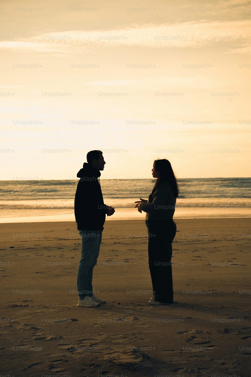 Couple talking on a beach at sunset photo – Portrait Image on Unsplash Couple talking on a beach at sunset photo – Portrait Image on Unsplash