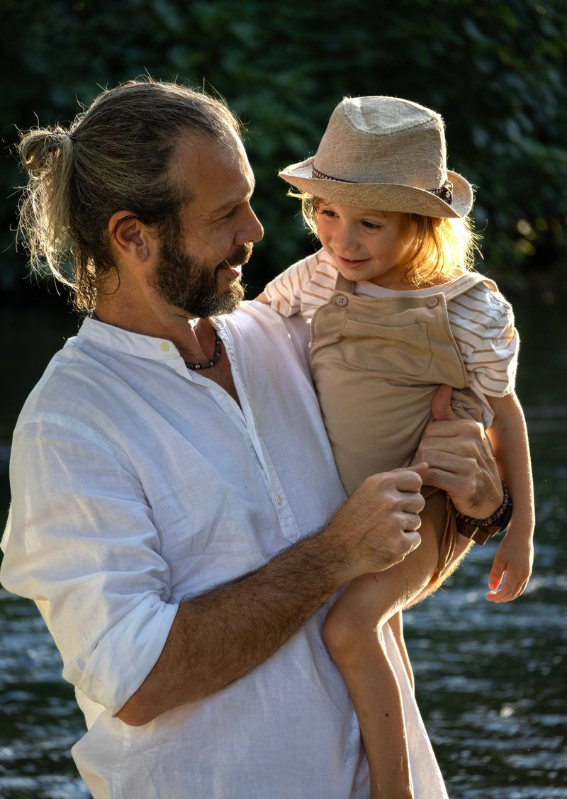 Father and Child Smiling by a River · Free Stock Photo Father and Child Smiling by a River · Free Stock Photo