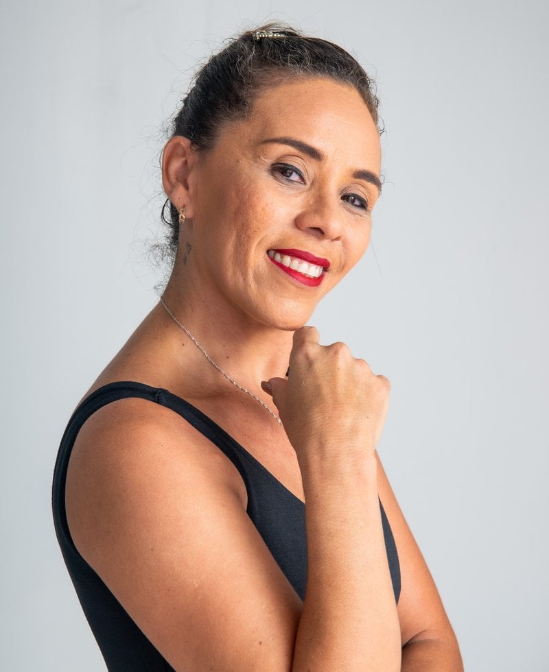 Happy Brunette Woman Posing in Studio · Free Stock Photo