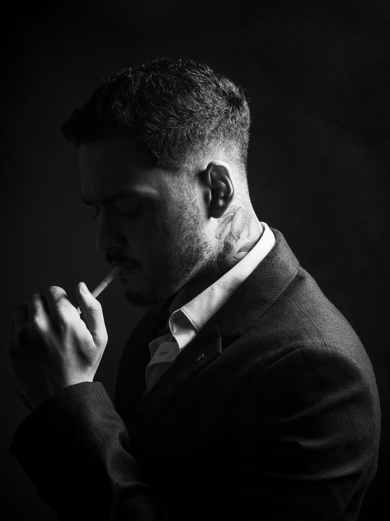 Moody Black and White Portrait of Man Smoking · Free Stock Photo
