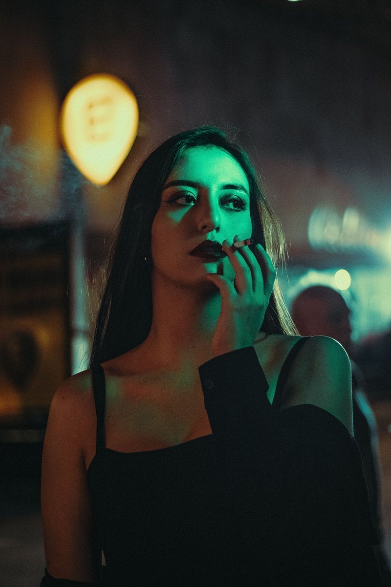 Moody Urban Night Portrait of Contemplative Woman · Free Stock Photo