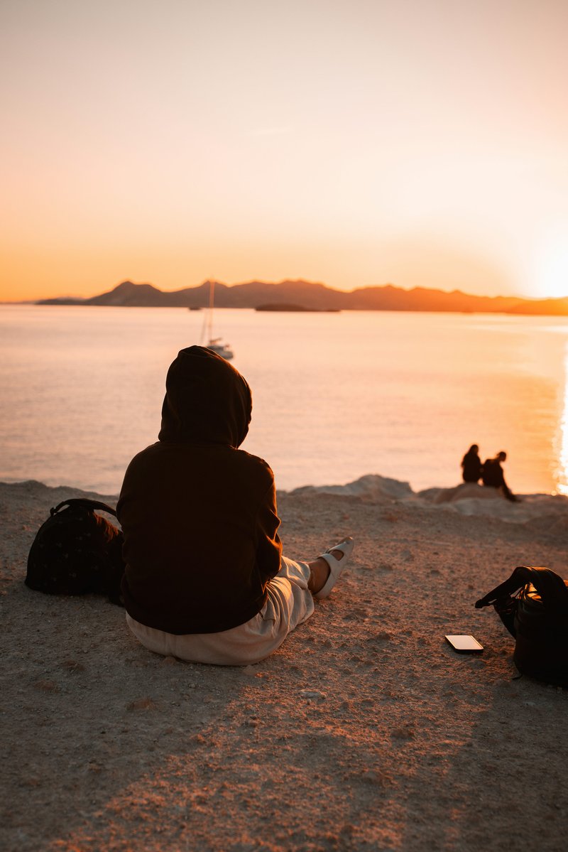 Person watching sunset over the sea in milos photo &ndash; Free Sunset Image on  Unsplash