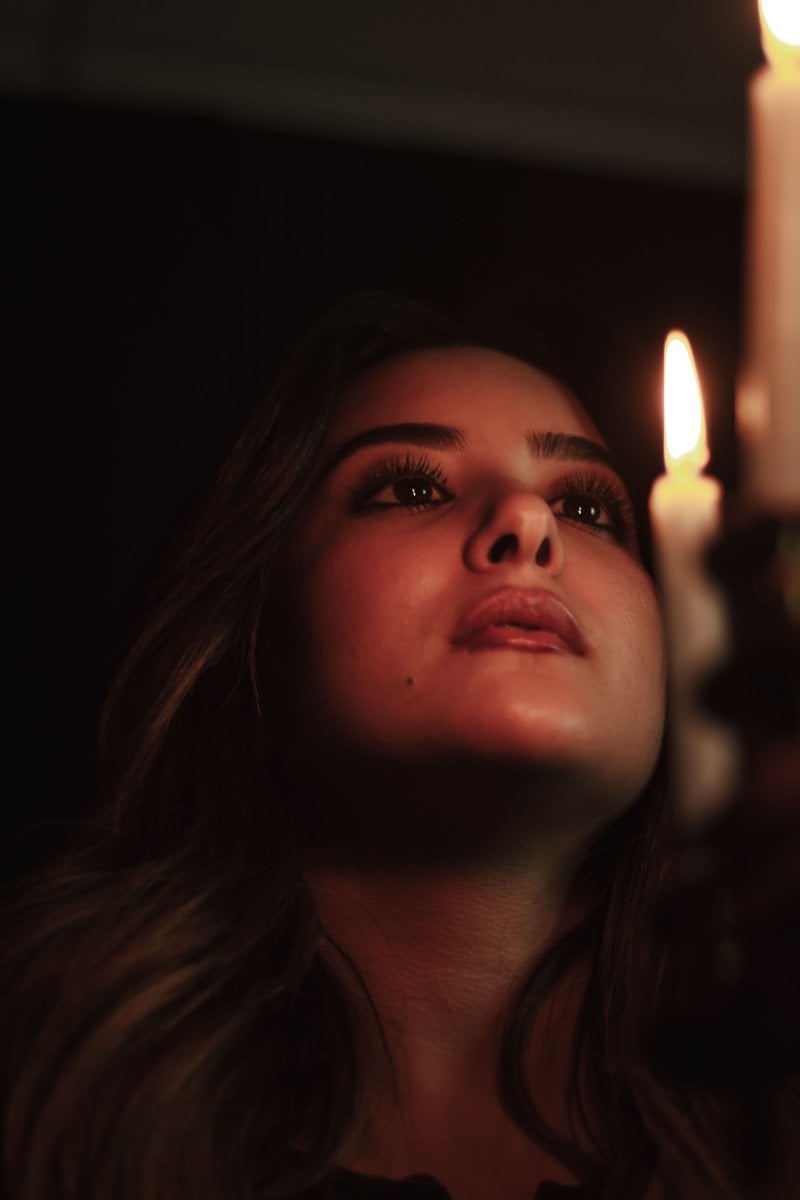 Portrait of Woman by Candlelight in Dark Setting · Free Stock Photo
