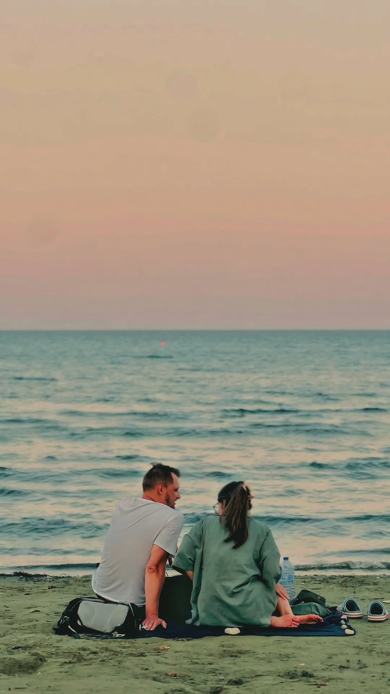 Romantic Couple on Tranquil Beach at Sunset Romantic Couple on Tranquil Beach at Sunset