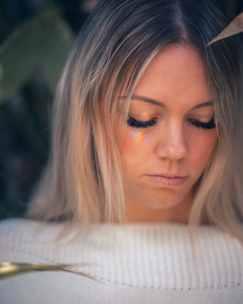 Sad woman with blond hair looking down · Free Stock Photo