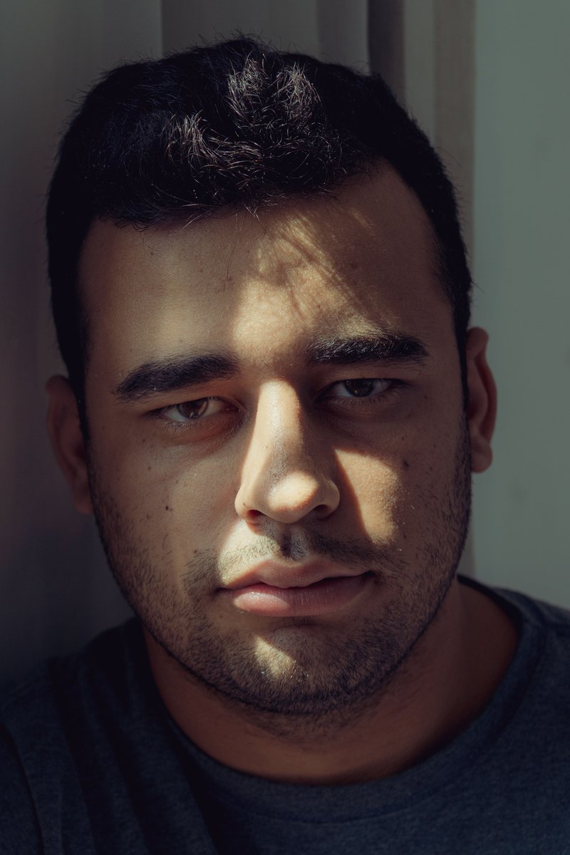 Serious Man in Red Crew Neck Shirt · Free Stock Photo