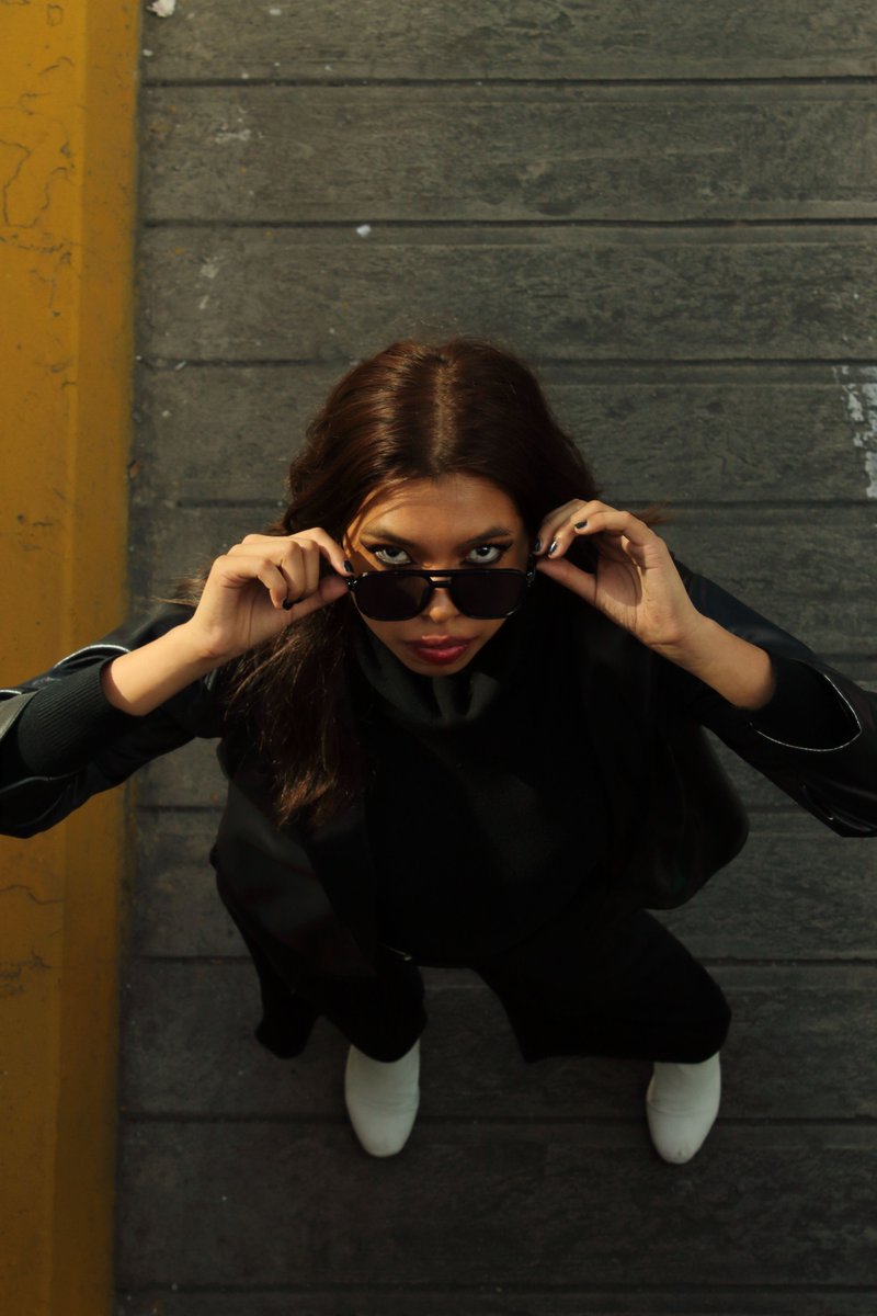 Stylish Woman Posing in Urban Setting &middot; Free Stock Photo