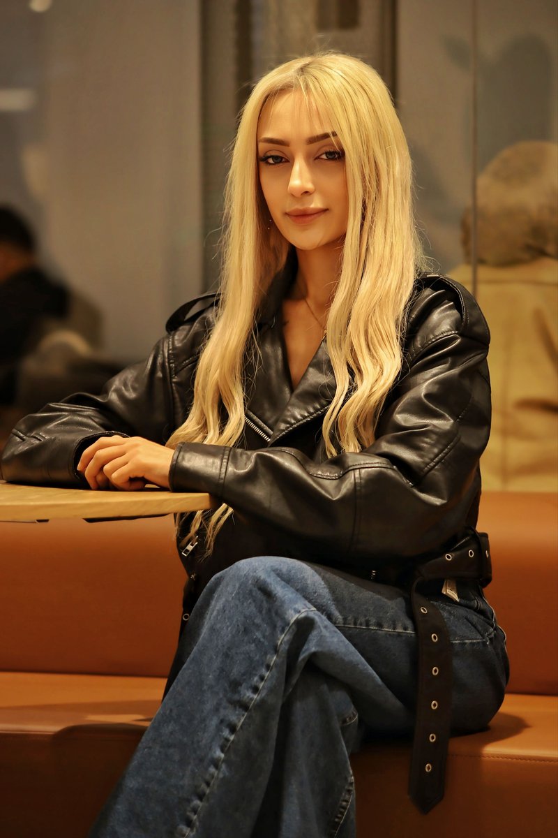 Stylish Woman in Leather Jacket at Cafe · Free Stock Photo