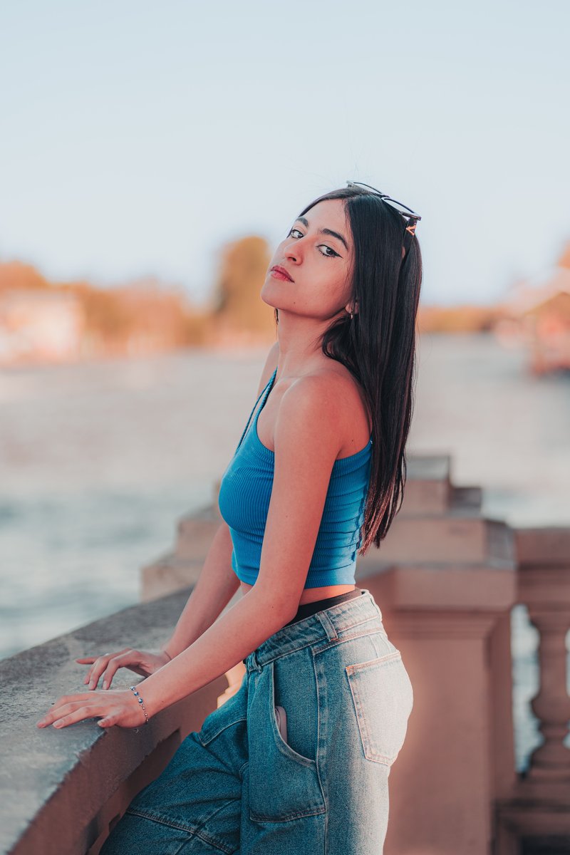 Stylish Young Woman Enjoying River View &middot; Free Stock Photo