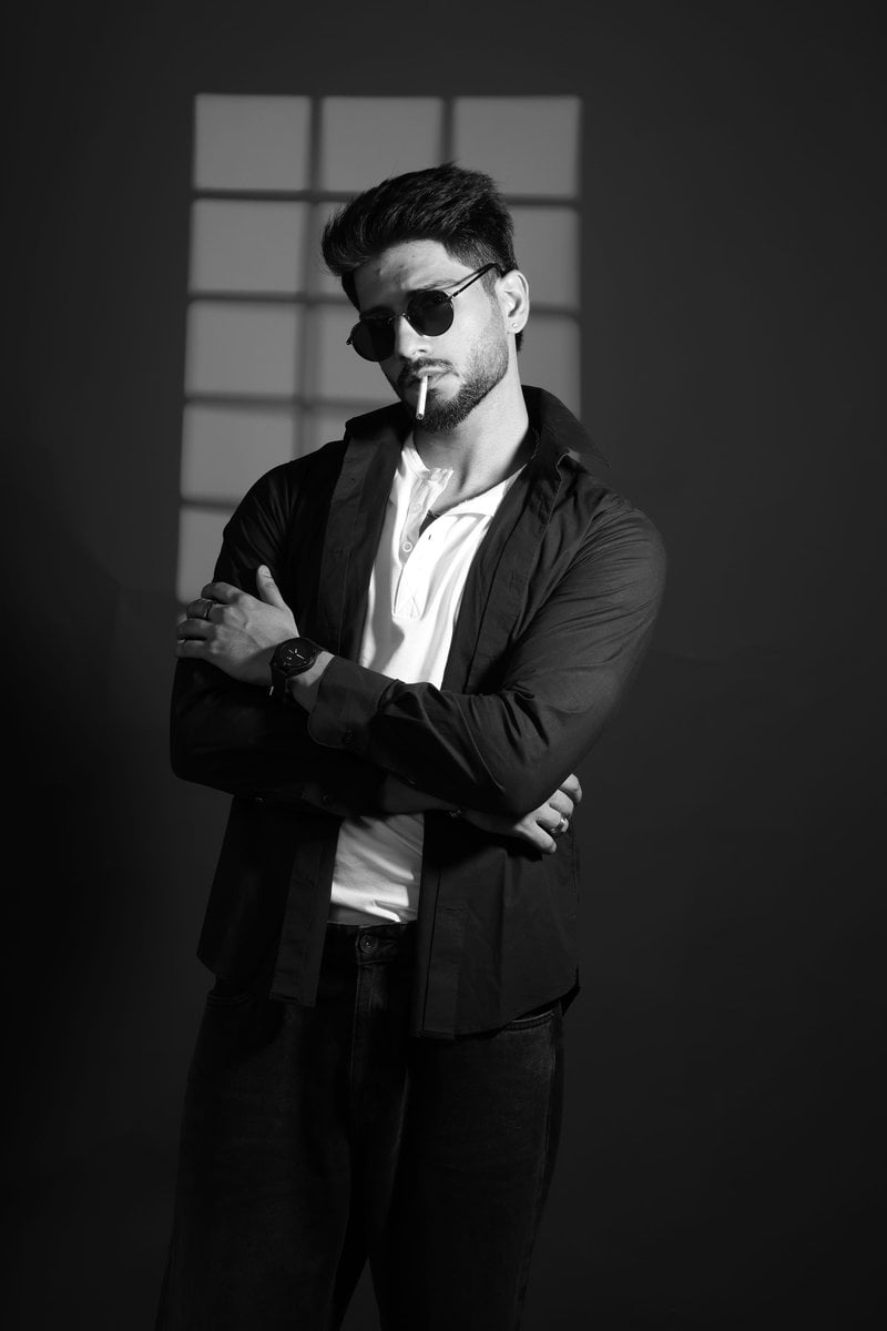 Stylish man with sunglasses and cigarette against a dark background. photo – Free Watch Image on Unsplash Stylish man with sunglasses and cigarette against a dark background. photo – Free Watch Image on Unsplash
