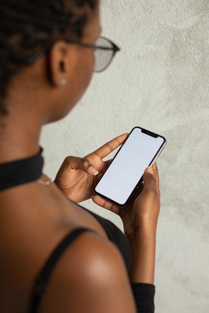 Woman Holding a Mobile Phone · Free Stock Photo