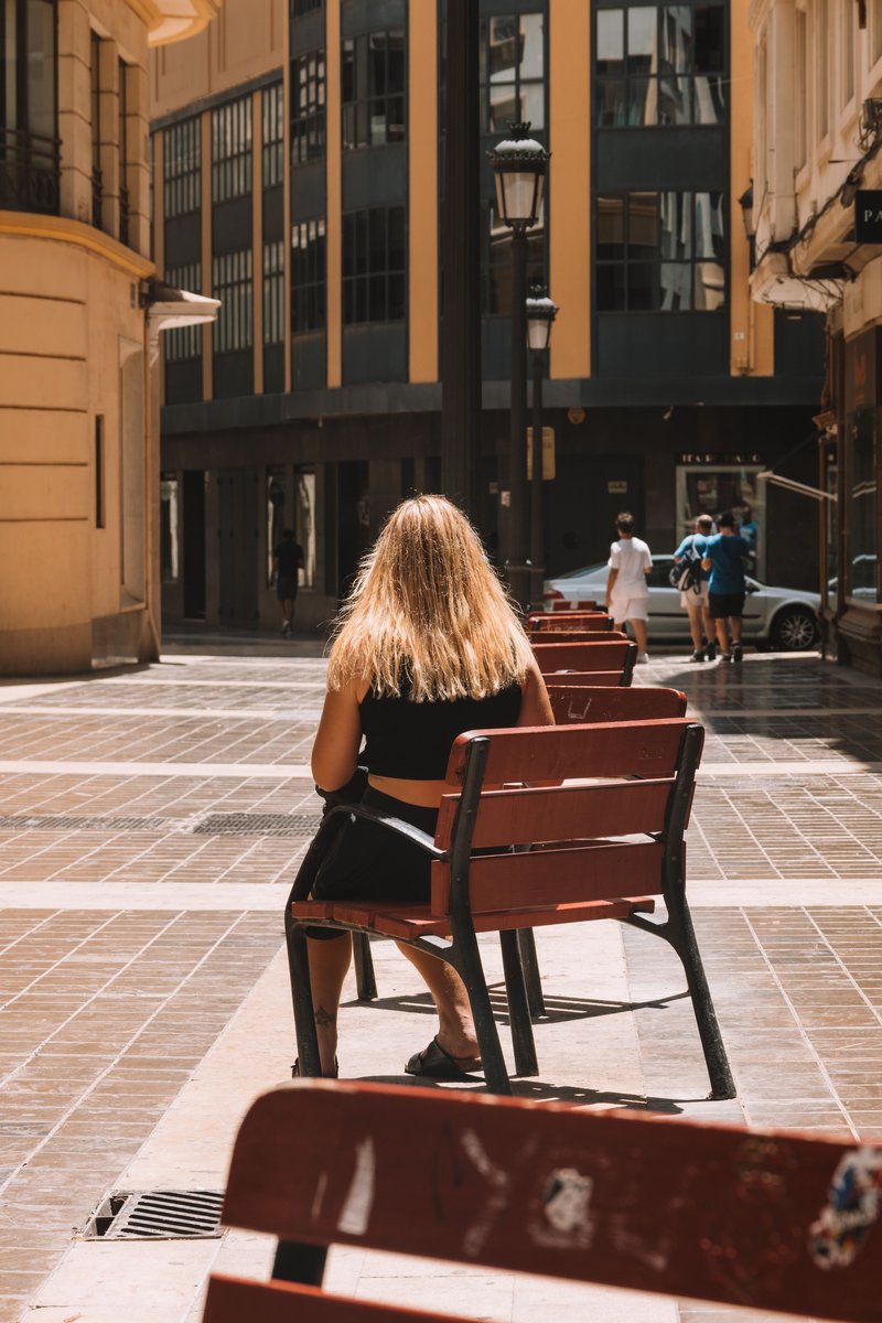 Woman Sitting Alone in the City &middot; Free Stock Photo