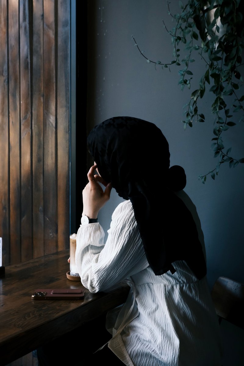 Woman Sitting Behind Desk Wearing Turban · Free Stock Photo