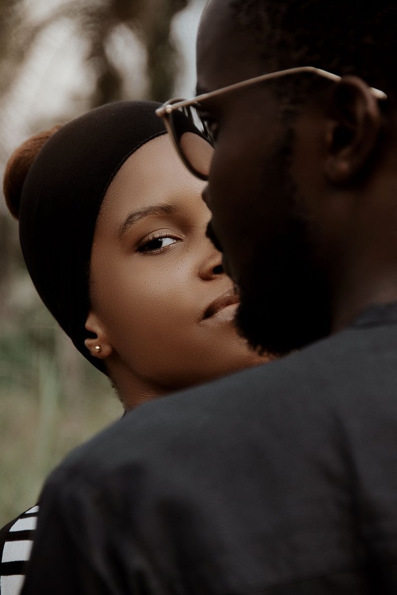 Woman Standing behind a Man in Glasses and Looking over His Shoulder &middot; Free  Stock Photo