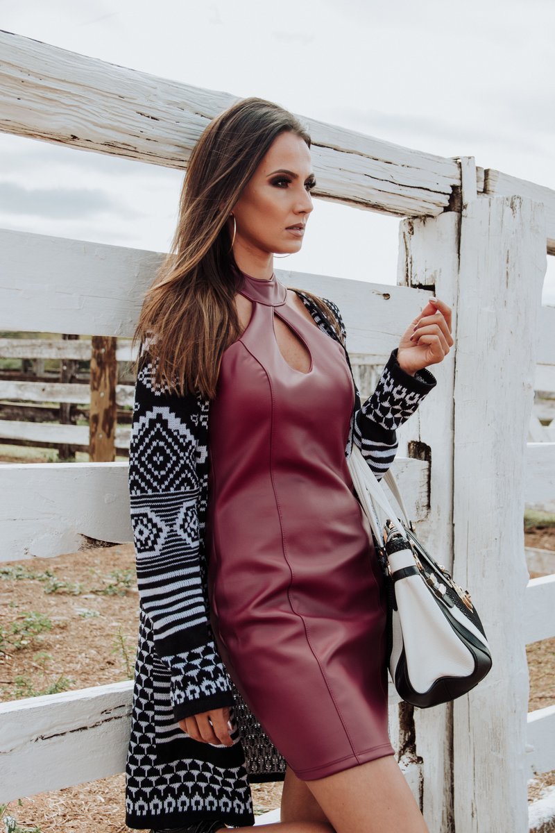 Woman Wearing Maroon Leather Dress and Cardigan Leaning on White Plank Wall  &middot; Free Stock Photo