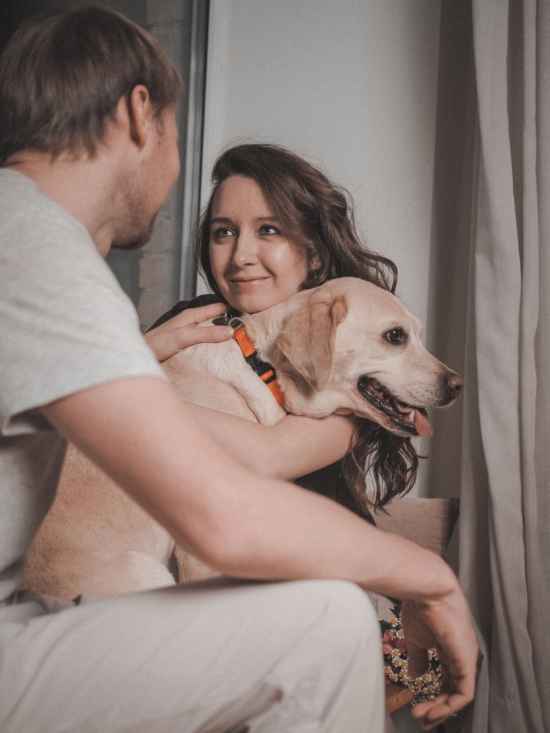 Woman and Man Sitting with Dog &middot; Free Stock Photo