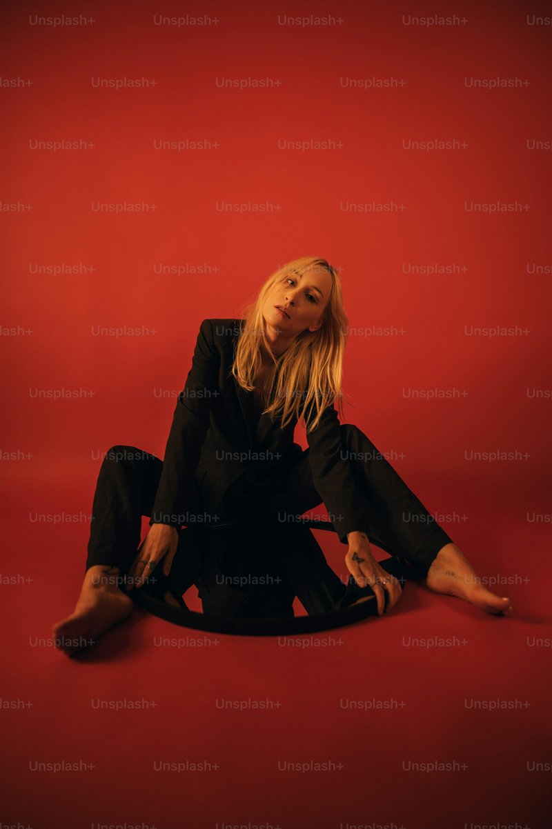 Woman in black long sleeve shirt lying on red couch photo ... Woman in black long sleeve shirt lying on red couch photo ...