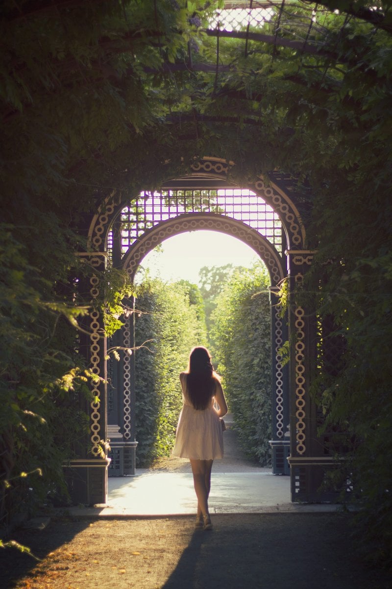 Woman walking alone on pathway photo – Free Woman Image on Unsplash