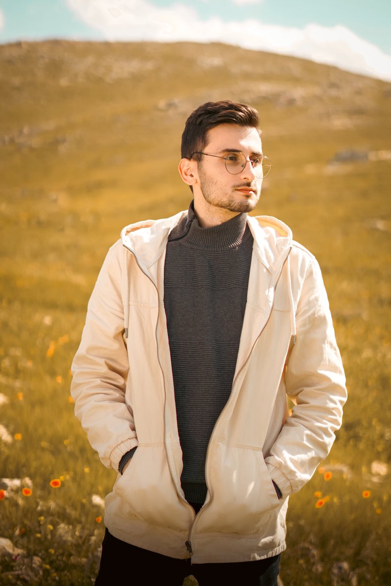 Fashionable Man in Scenic Nature Setting · Free Stock Photo Fashionable Man in Scenic Nature Setting · Free Stock Photo