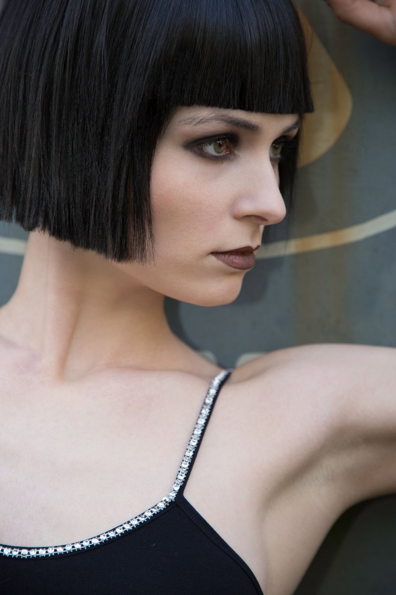 A Close Up of a Woman With a Fringe Hairstyle &middot; Free Stock Photo