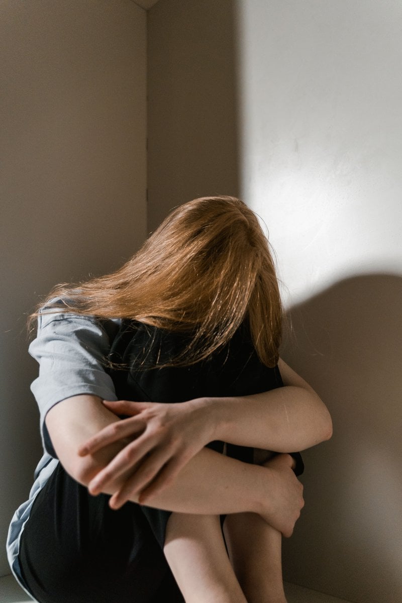 A Lonely Woman Sitting by Herself &middot; Free Stock Photo