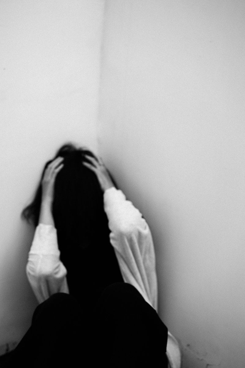 Depressed woman sitting in room corner &middot; Free Stock Photo