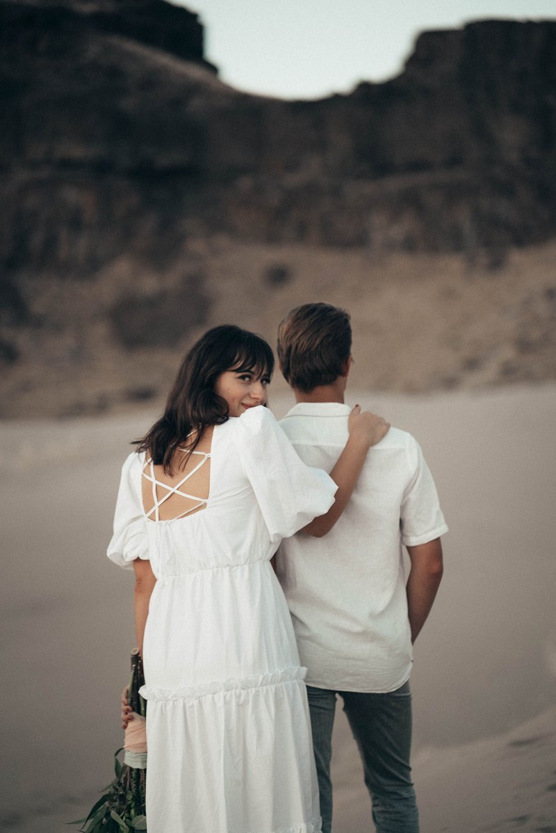 Loving newlyweds standing on sandy ground in nature · Free ... Loving newlyweds standing on sandy ground in nature · Free ...