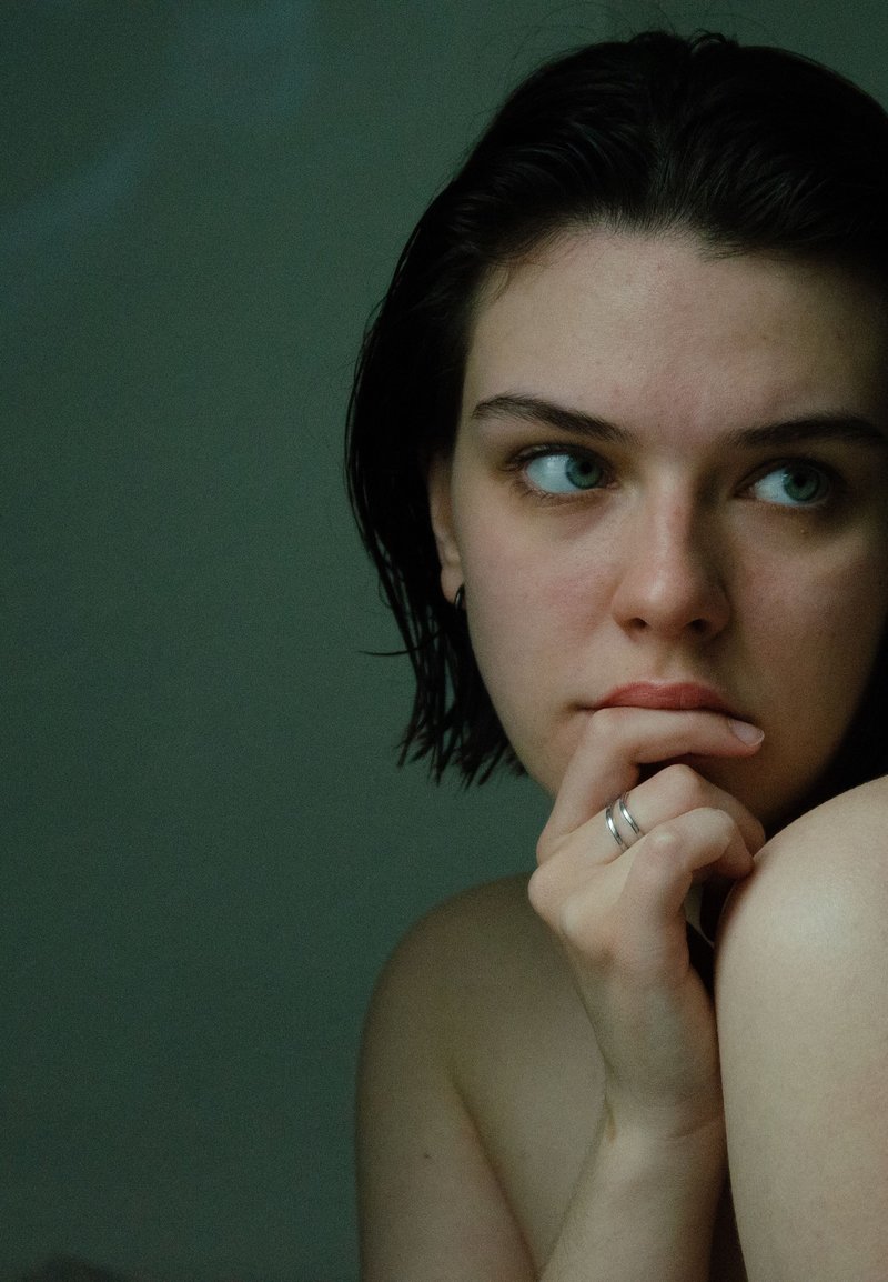 Thinking Woman with Hand on Chin · Free Stock Photo