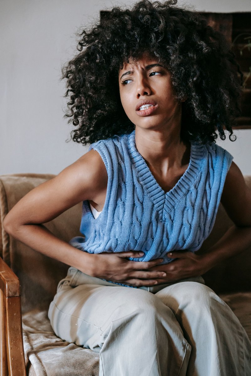 Woman Suffering from a Stomach Pain &middot; Free Stock Photo