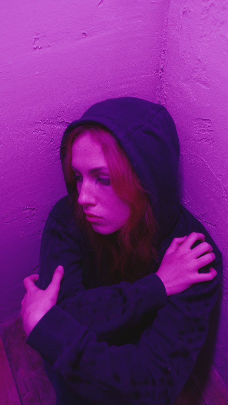 Woman Wearing Hoodie Being Anxious