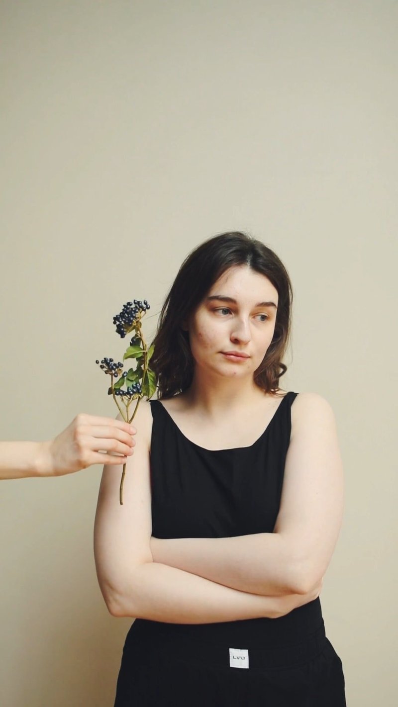person Giving Flower to a Beautiful Woman